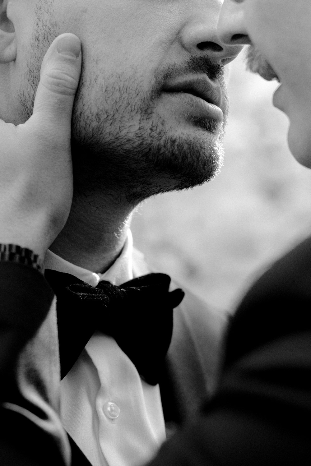 close up of grooms about to kiss before their science north wedding