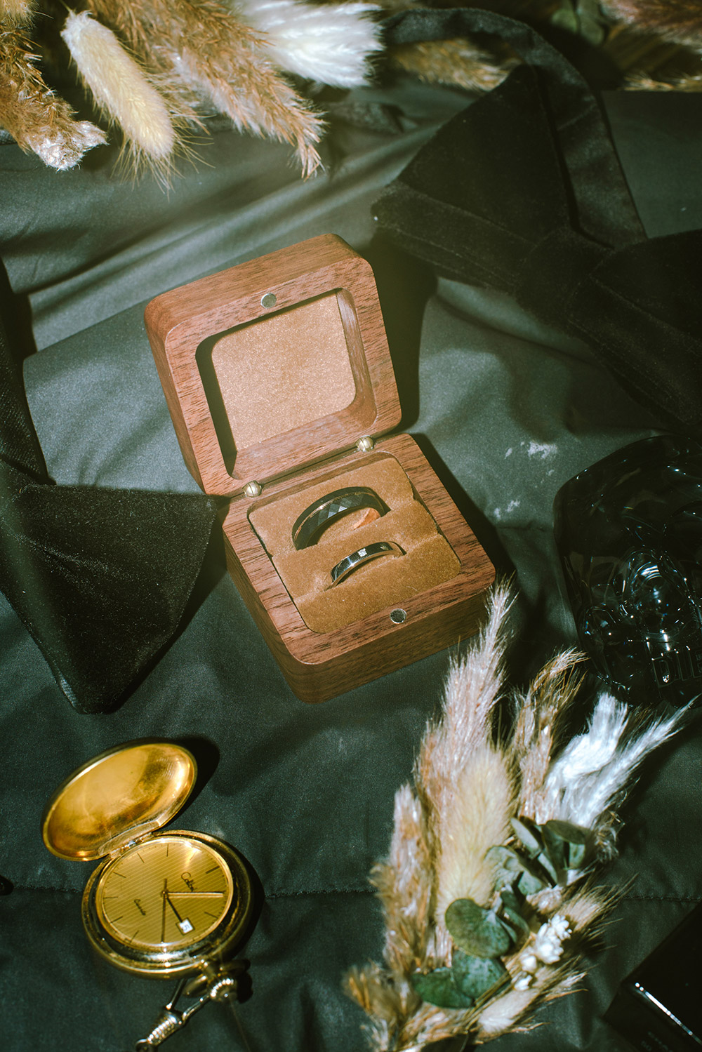 rings displayed in a wooden rign box from a science north wedding