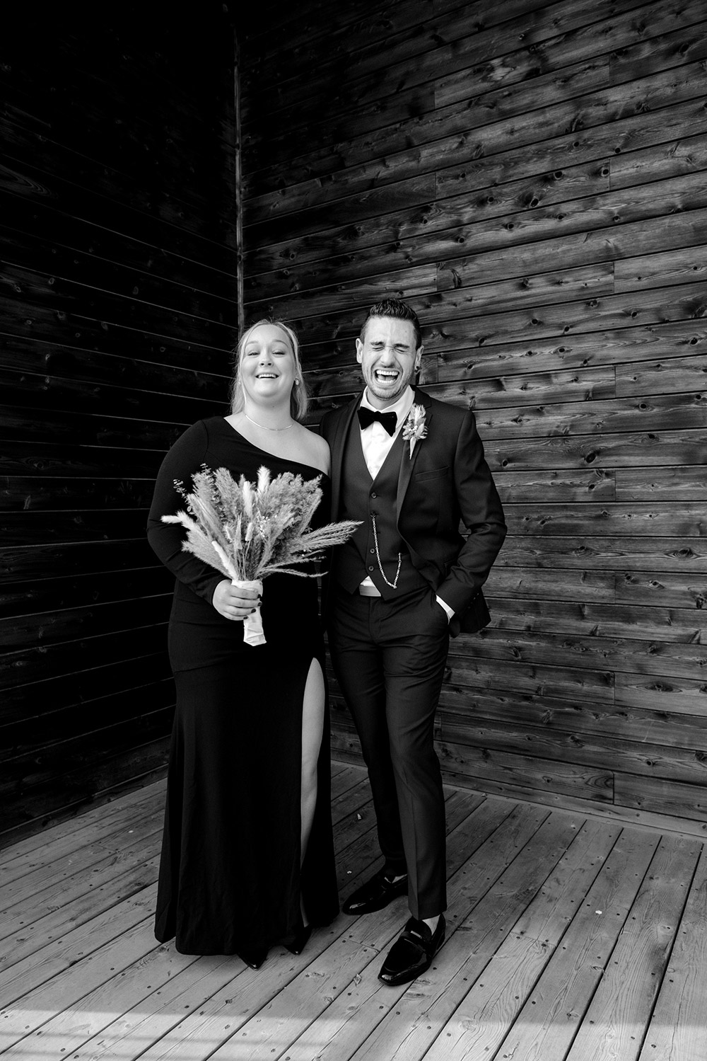 groom and friend pose together whiel groom bursts out in laughter at this science north wedding