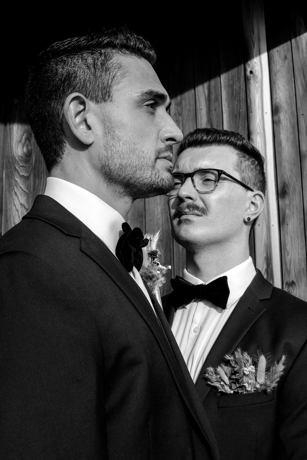 artisitically posed photo of grooms facing different directions at this science north wedding