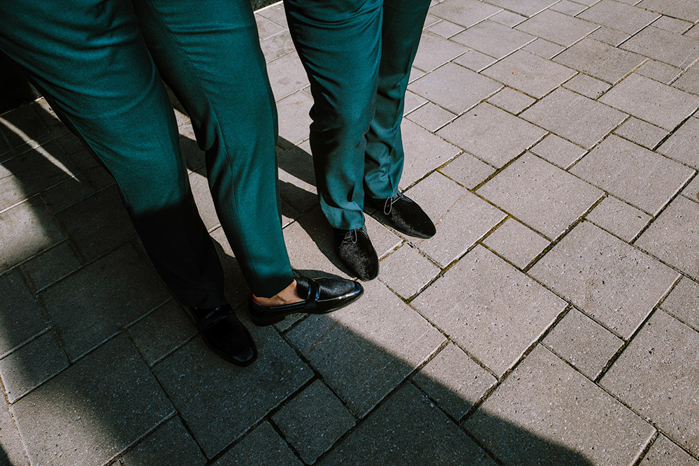 shot of grooms pants and shoes at this science north wedding