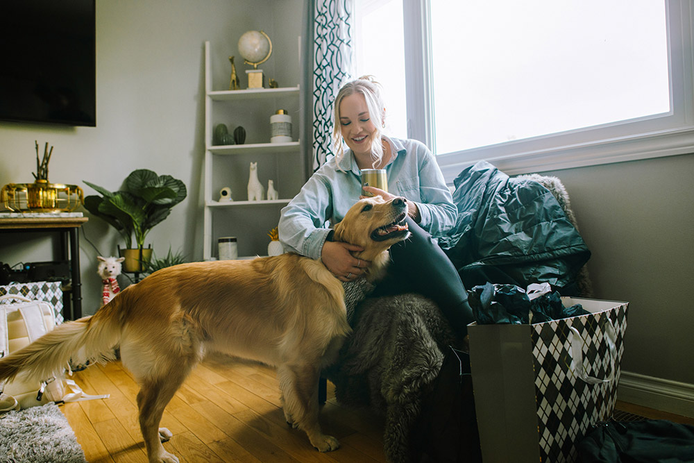 dog and bridesmaid cuddle in the morning before this science north wedding