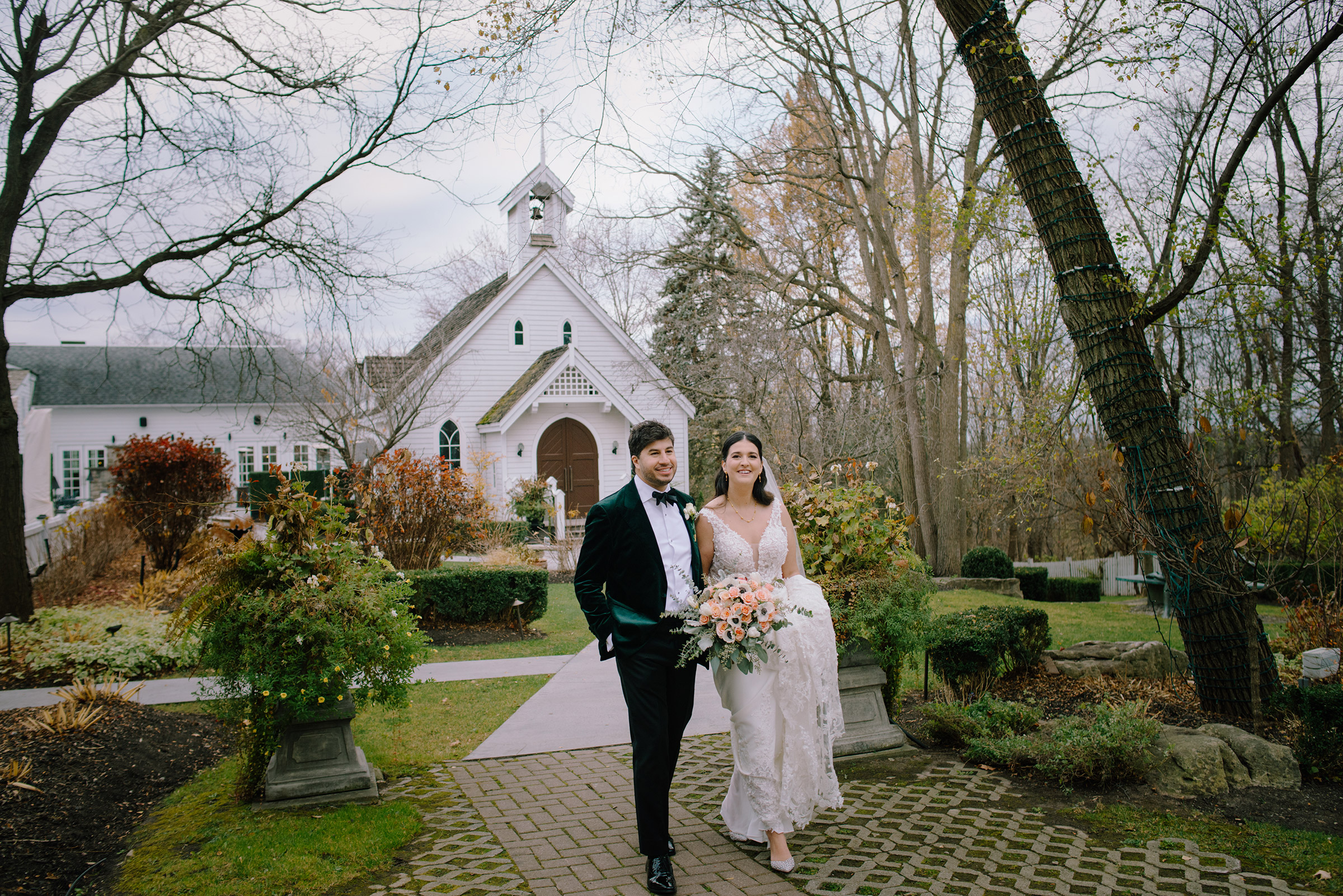 The Doctor's House Wedding Venue Bride Wedding couple photography of couple walking down the path from the chapel in Late fall.