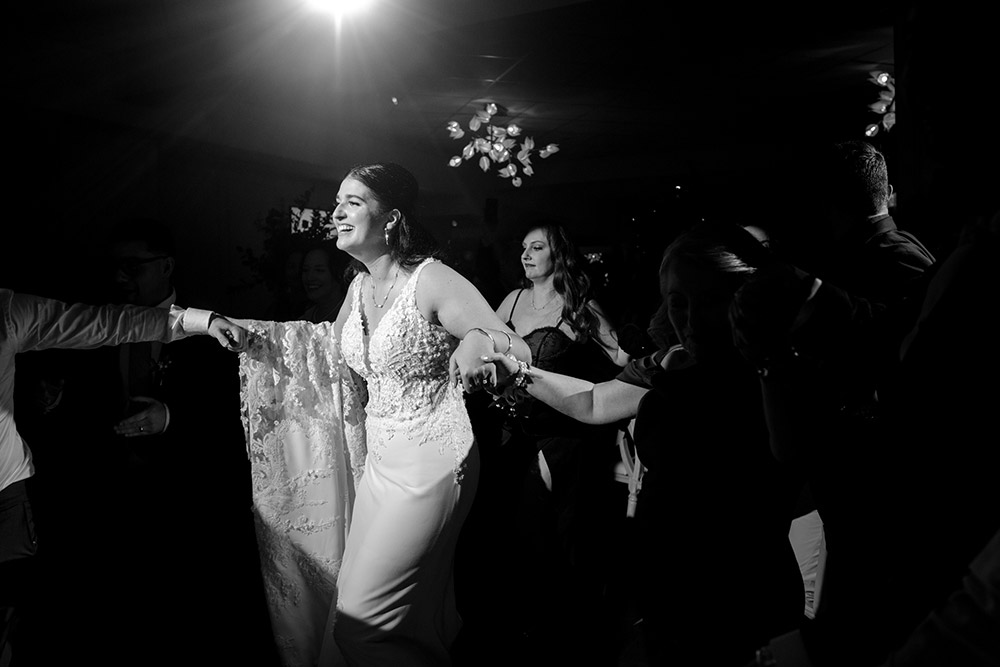 bride dances at her wedding at The Doctor's House Wedding