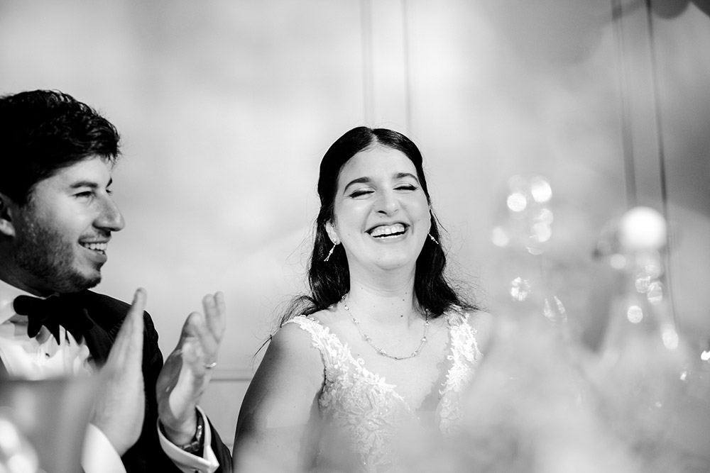 bride and groom laugh during speeches at at The Doctor's House Wedding