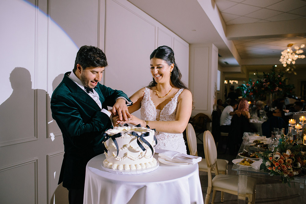 couple cut the cake at The Doctor's House Wedding