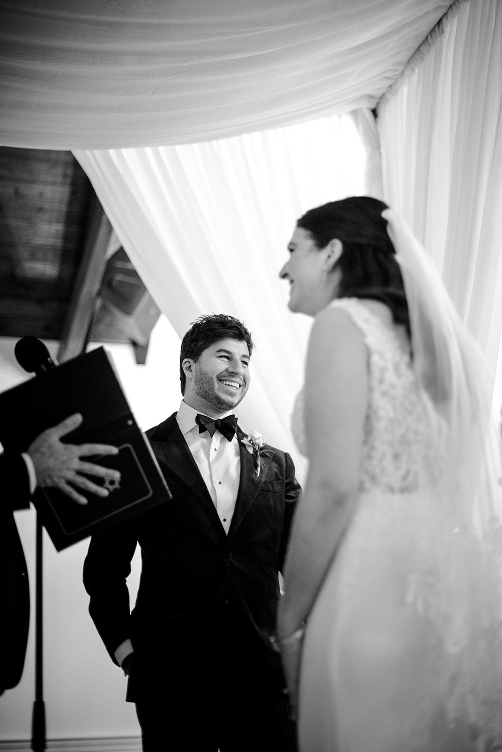 groom smiles during his ceremony at The Doctor's House Wedding
